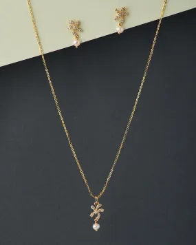 A cute pendant matched with golden polish chain with matching earrings.